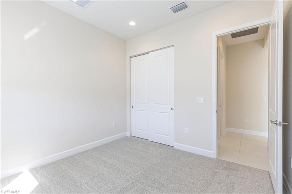 2749 Durham Circle Naples, FL 34112 - Photo 13 of 30 a view of an empty room