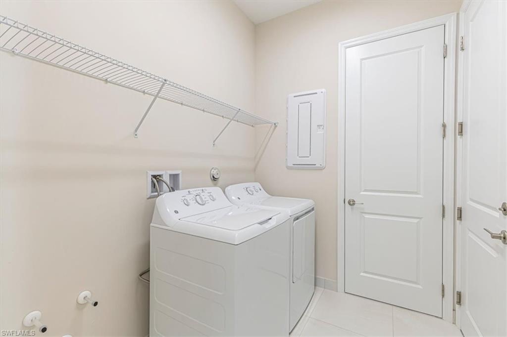 2749 Durham Circle Naples, FL 34112 - Photo 14 of 30 a utility room with dryer and washer