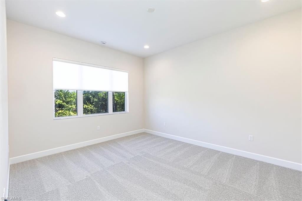 2749 Durham Circle Naples, FL 34112 - Photo 16 of 30 an empty room with a window