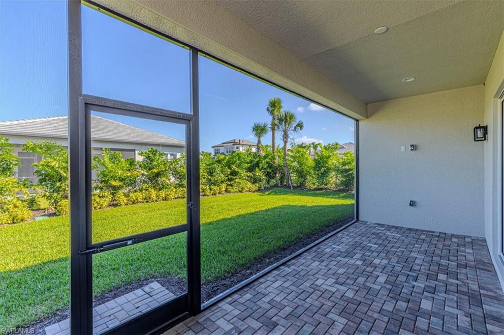 2749 Durham Circle Naples, FL 34112 - Photo 25 of 30 a view of porch with a yard