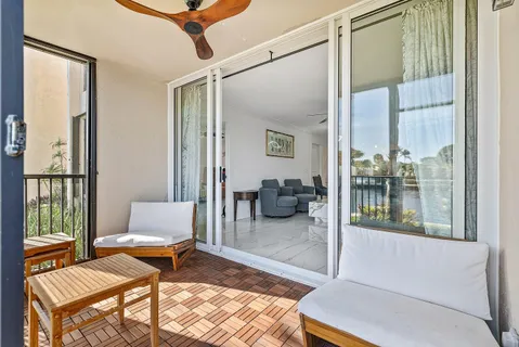 a view of a balcony with wooden floor