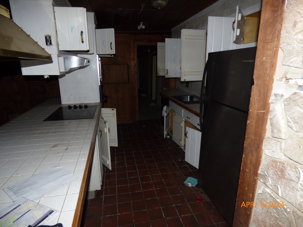 8 Cold Spring Road Southampton, MA 01073 - Photo 9 of 20 a kitchen with a sink a refrigerator and cabinets