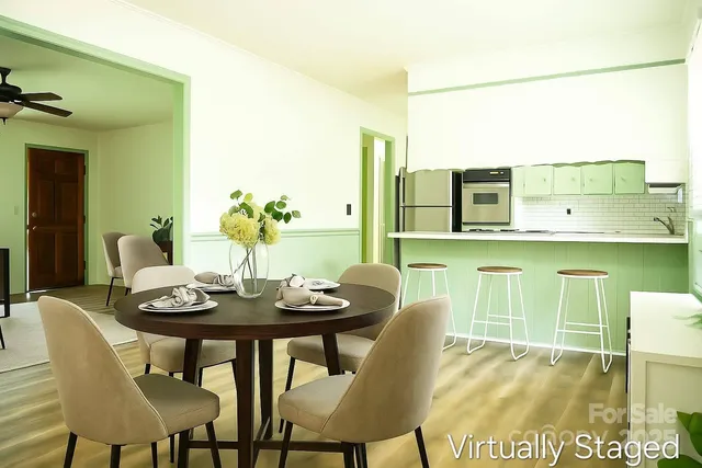a dining room with furniture and wooden floor