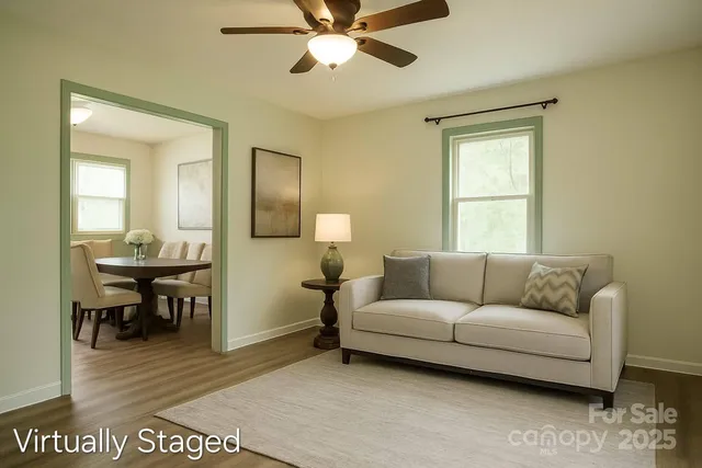 a living room with furniture and a window