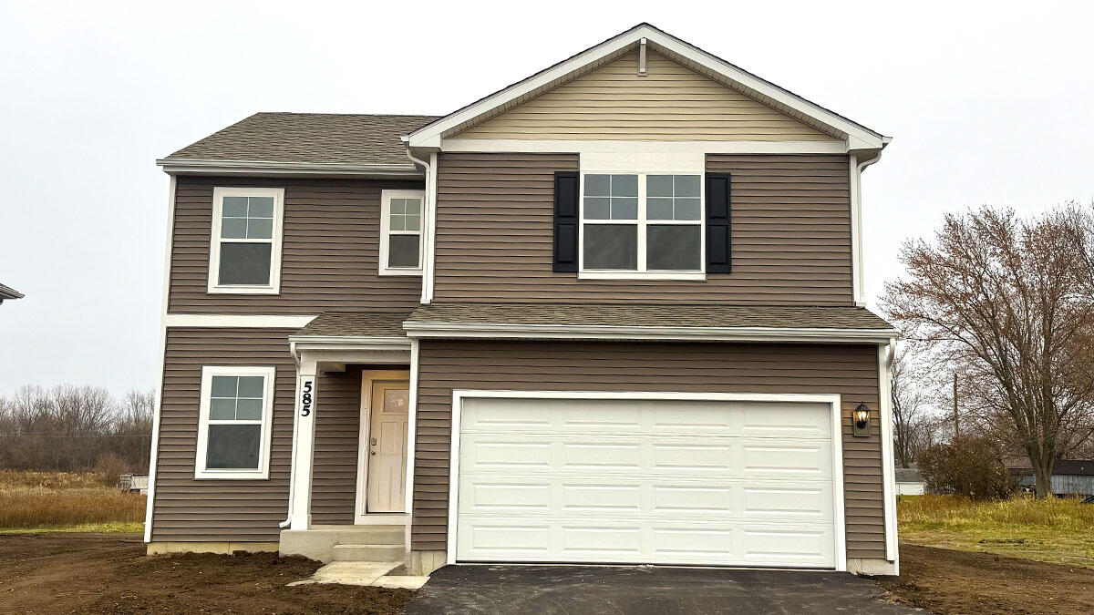 585 Marcella Street Hebron, IN 46341 - Photo 1 of 21 a front view of a house