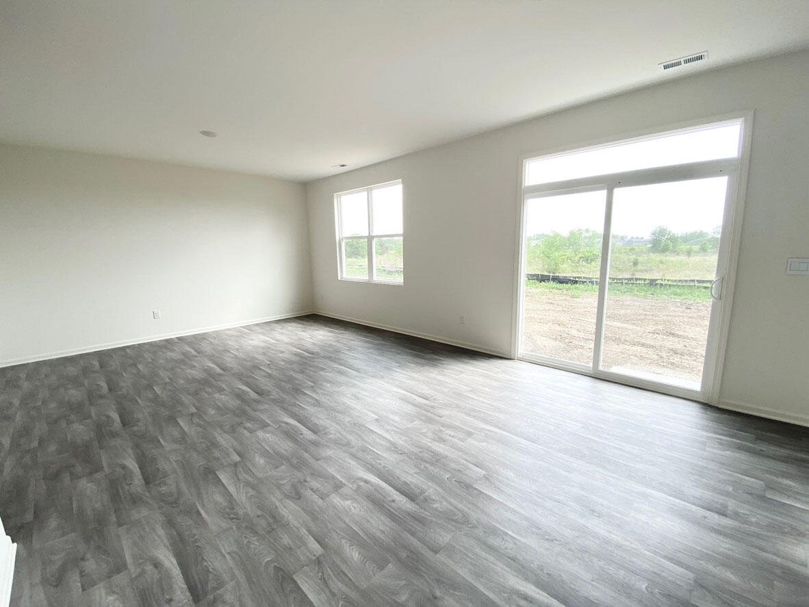 585 Marcella Street Hebron, IN 46341 - Photo 12 of 21 wooden floor in an empty room with a window