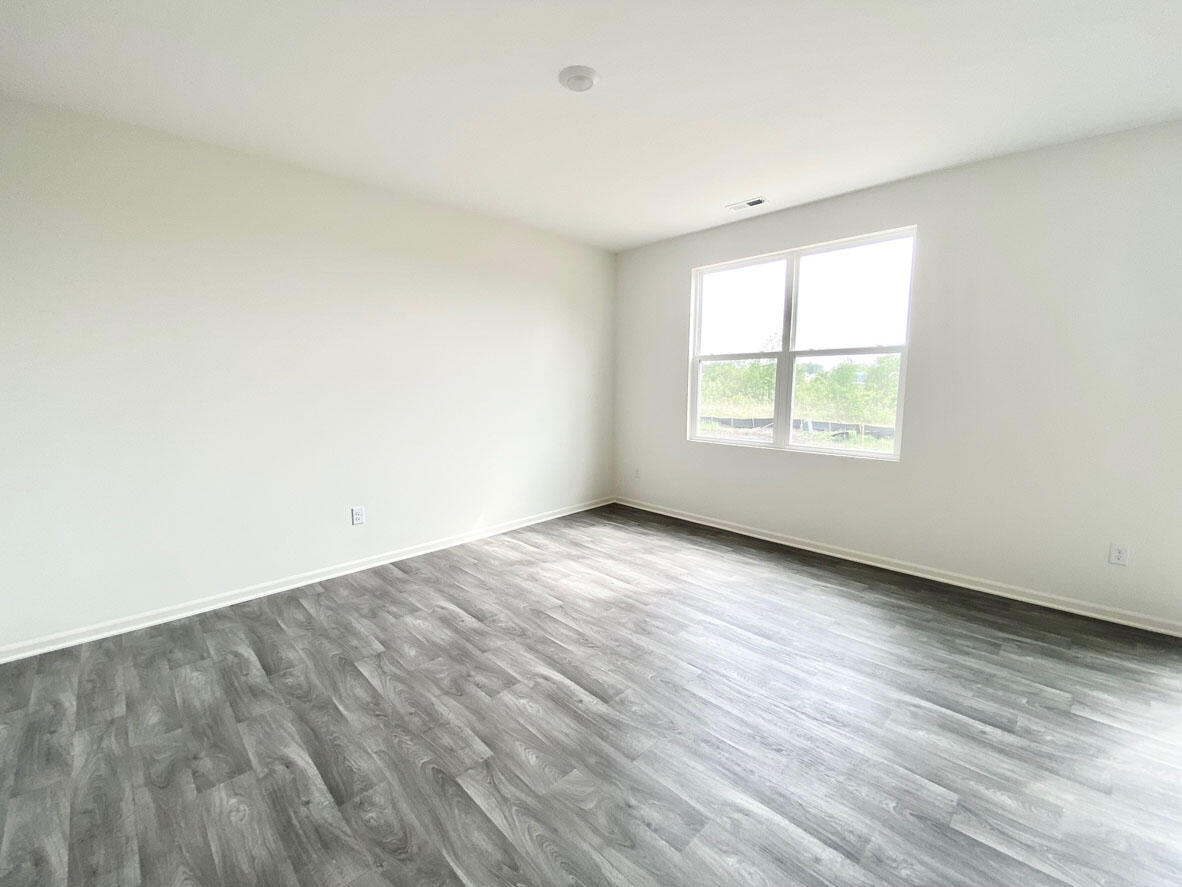 585 Marcella Street Hebron, IN 46341 - Photo 14 of 21 an empty room with wooden floor and windows