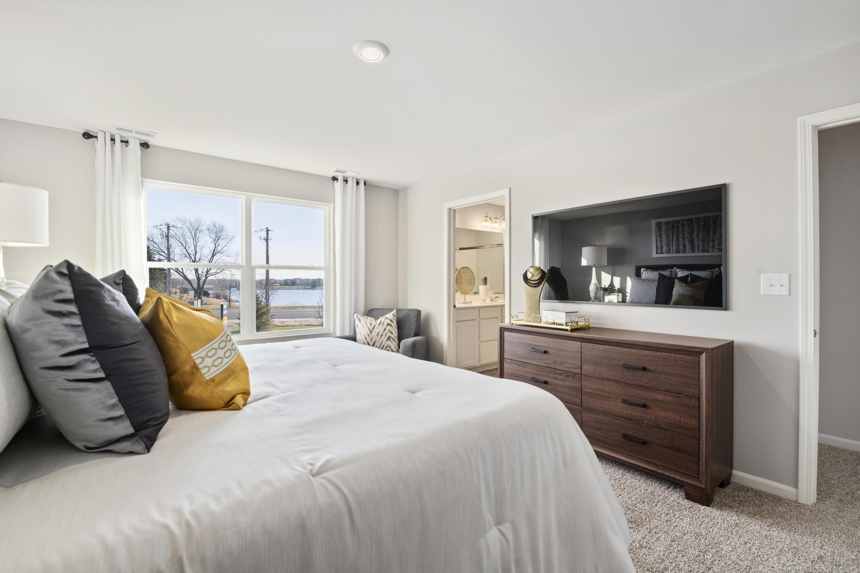 585 Marcella Street Hebron, IN 46341 - Photo 19 of 21 a bedroom with a large bed and a flat tv screen on dresser