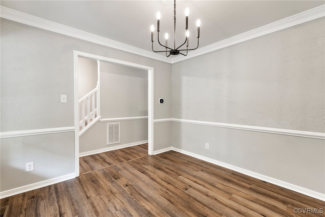 619 Spirea Road North Chesterfield, VA 23236 - Photo 6 of 26 a view of an empty room with wooden floor and a window