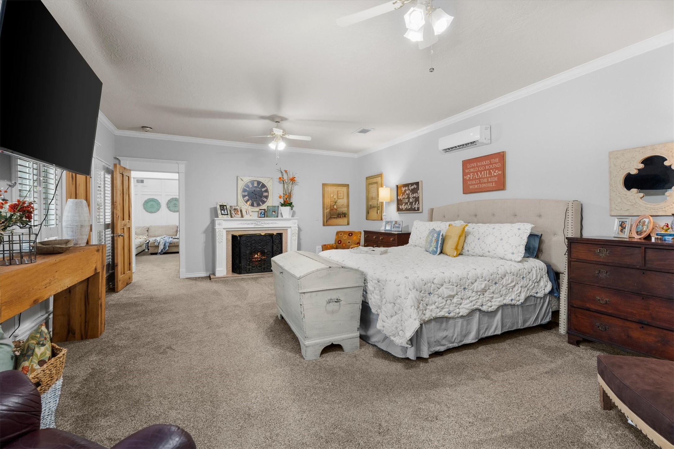 15902 Guinstead Drive Spring, TX 77379 - Photo 18 of 42 Primary bedroom featuring a cozy fireplace.
