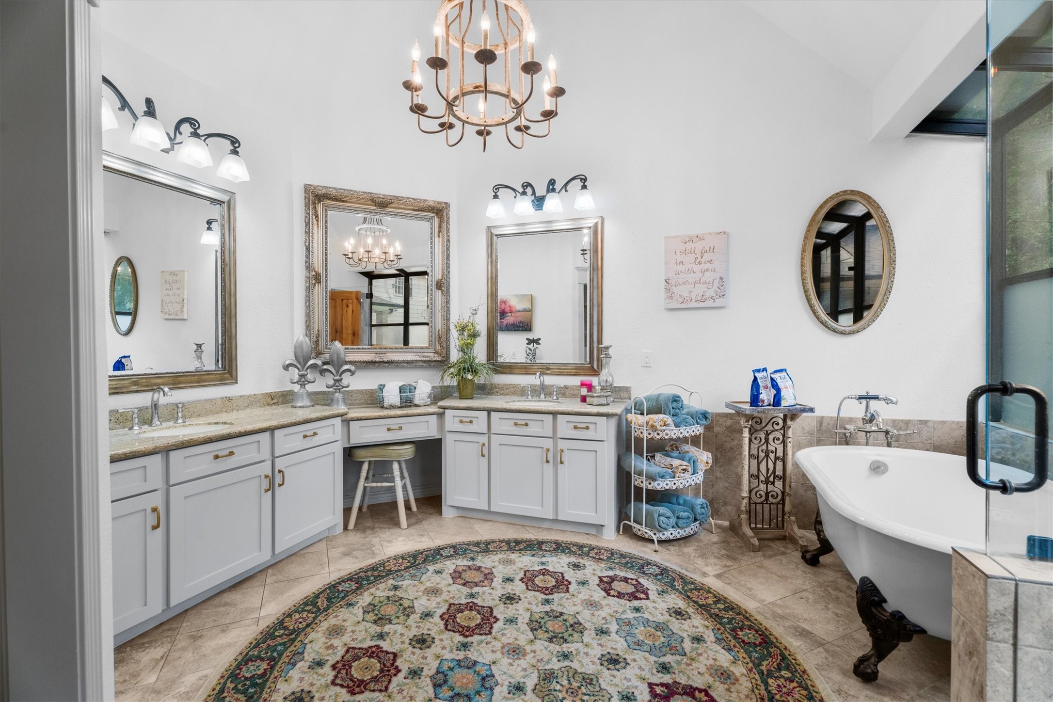 15902 Guinstead Drive Spring, TX 77379 - Photo 21 of 42 Elegant primary bathroom featuring dual vanities with granite countertops, a freestanding clawfoot tub, and a walk-in shower.