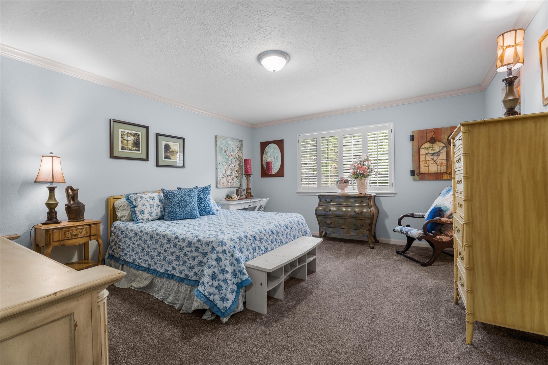 15902 Guinstead Drive Spring, TX 77379 - Photo 32 of 42 Bedroom featuring soft blue walls, cozy carpeting, and a window with shutters.