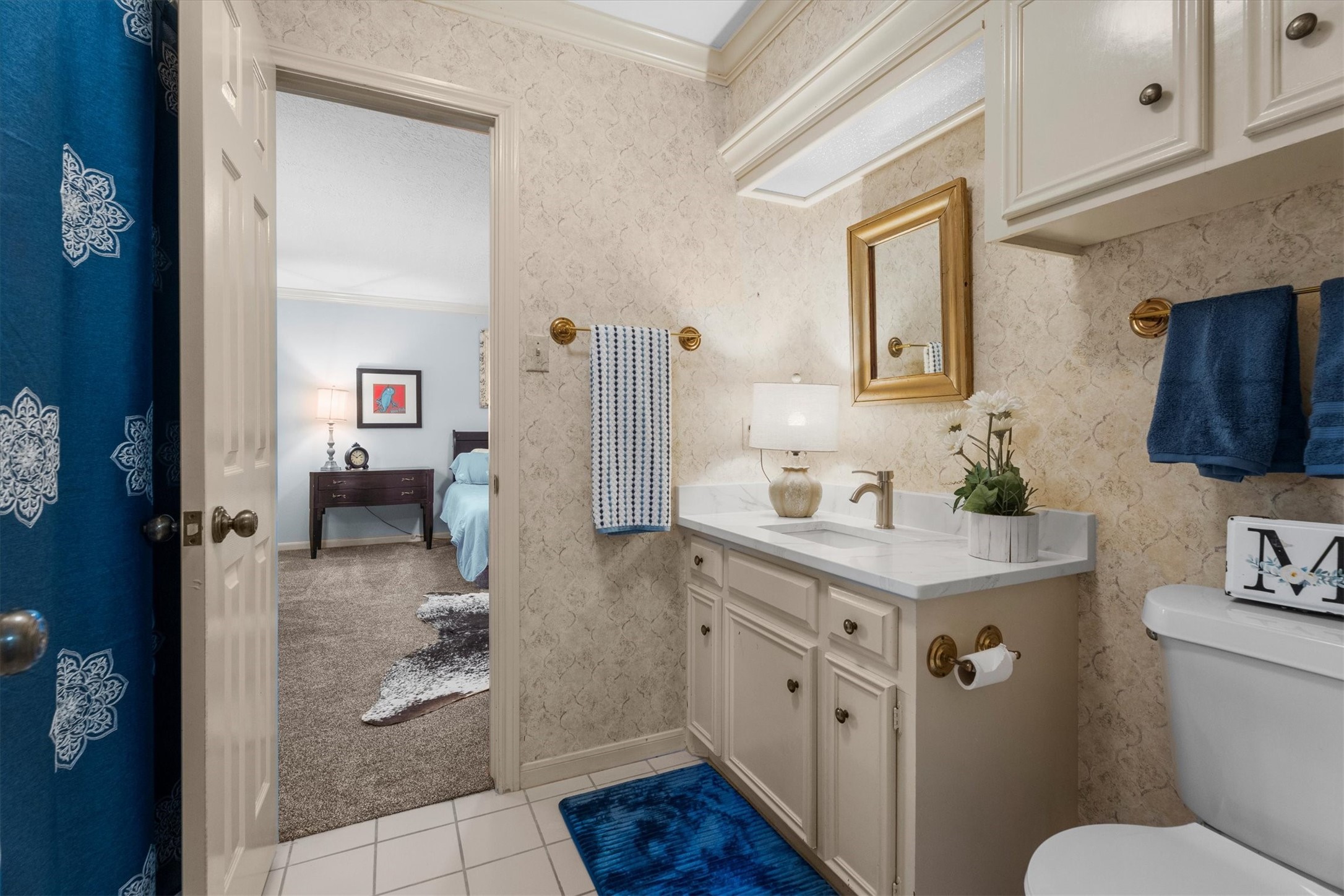 15902 Guinstead Drive Spring, TX 77379 - Photo 33 of 42 Bathroom with a classic design, complete with a marble countertop and vintage-style fixtures.