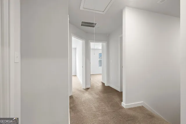 a view of a hallway with closet