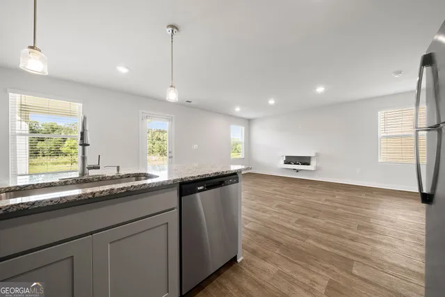 a kitchen with a sink and window