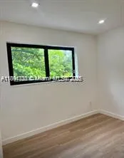 a view of a room with a large window