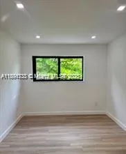 a view of a room with a window