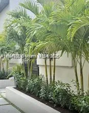 a view of flowing water with large building in front of it