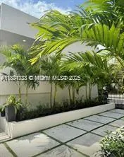 a kitchen that has a sink and a stove in it