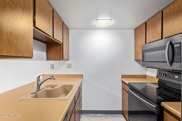 a view of a kitchen from the hallway