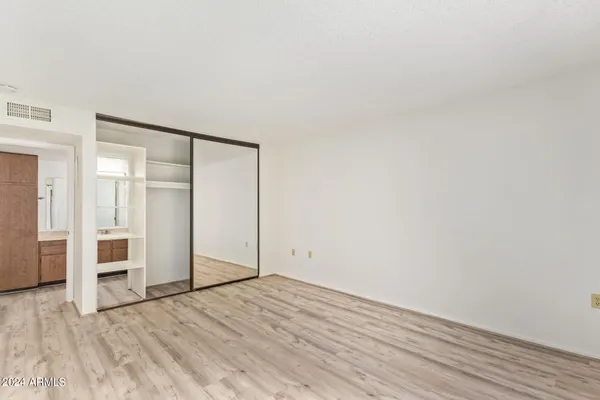 an empty room with wooden floor