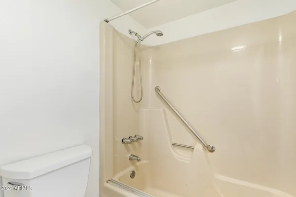 a bathroom with a sink and a large mirror
