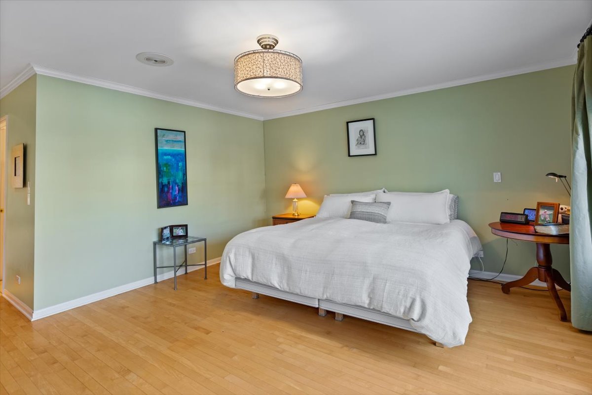 332 West Goethe Street Chicago, IL 60610 - Photo 11 of 29 a bedroom with a bed and a chandelier