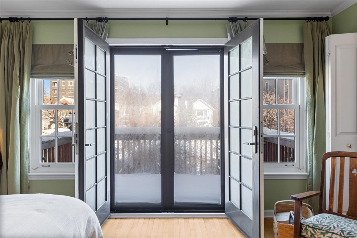 332 West Goethe Street Chicago, IL 60610 - Photo 12 of 29 a bathroom with a glass shower door and a wooden door