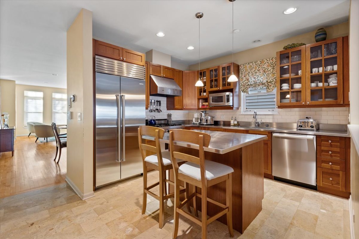 332 West Goethe Street Chicago, IL 60610 - Photo 5 of 29 a kitchen with stainless steel appliances granite countertop a sink and a refrigerator