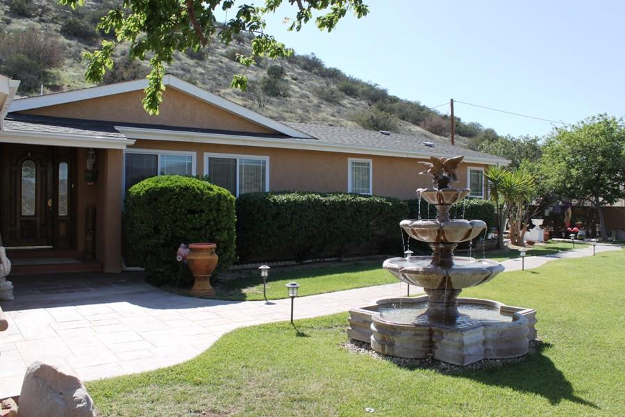 6110 Hubbard Road Acton, CA 93510 - Photo 1 of 46 a front view of a house with garden and trees