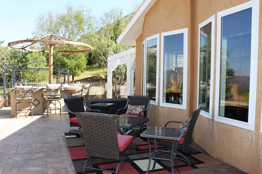 6110 Hubbard Road Acton, CA 93510 - Photo 25 of 46 a view of a patio with furniture and a yard