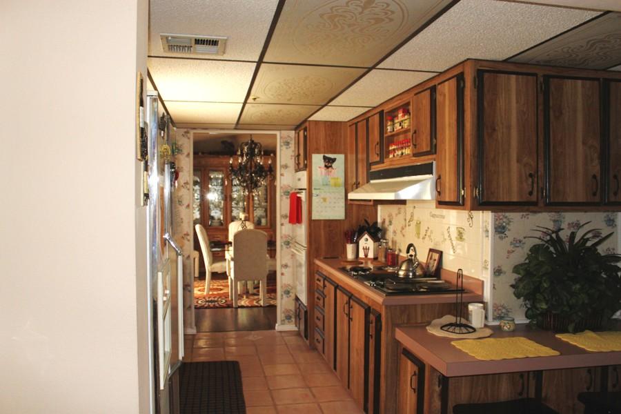 6110 Hubbard Road Acton, CA 93510 - Photo 31 of 46 a kitchen with stainless steel appliances granite countertop a sink a stove and a refrigerator