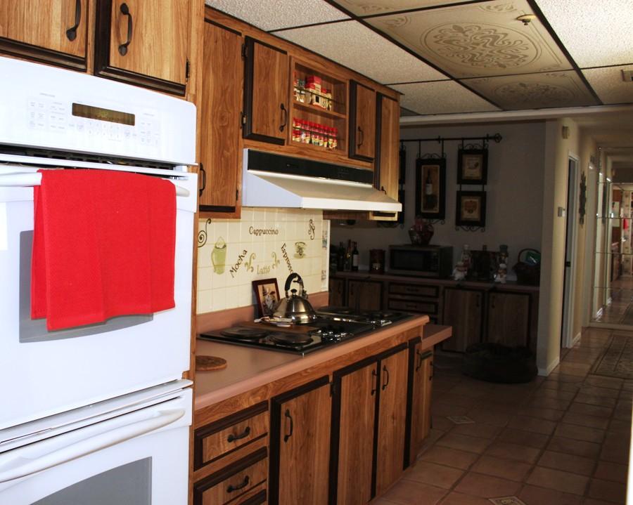 6110 Hubbard Road Acton, CA 93510 - Photo 9 of 46 a kitchen with stainless steel appliances granite countertop a sink stove and cabinets