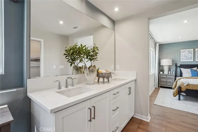 a en suite bathroom with a sink and a mirror