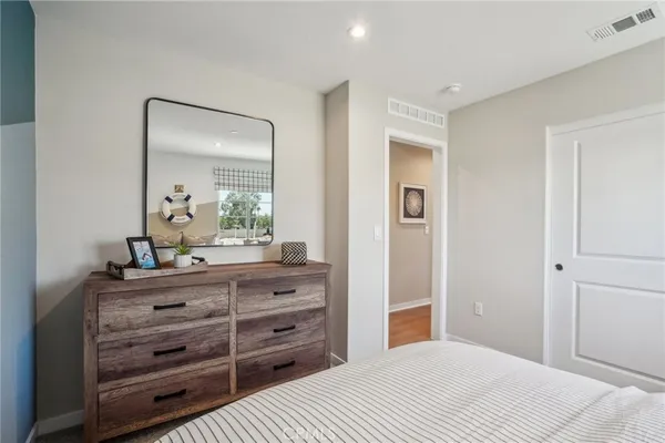 a bedroom with a bed and a dresser