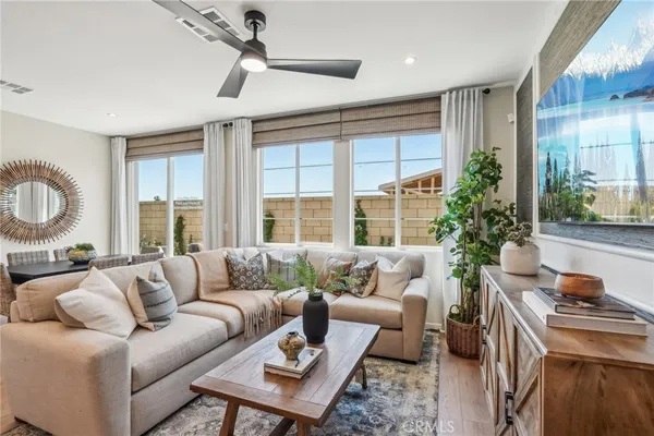 a living room with furniture and a large window