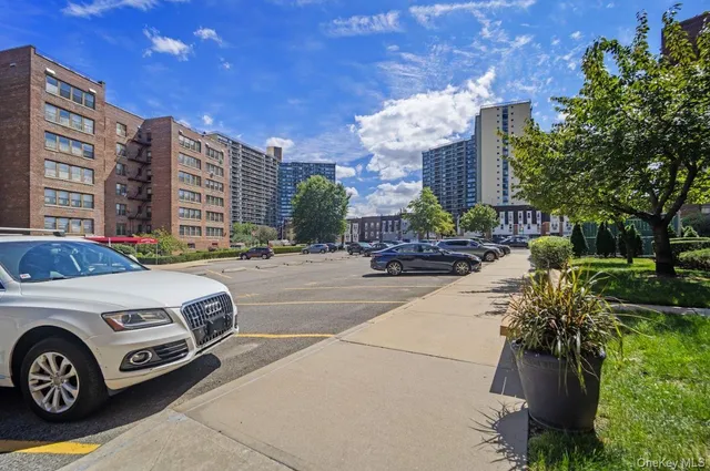 a front view of a building with parking space