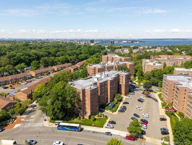 an aerial view of a house with a garden and lake view