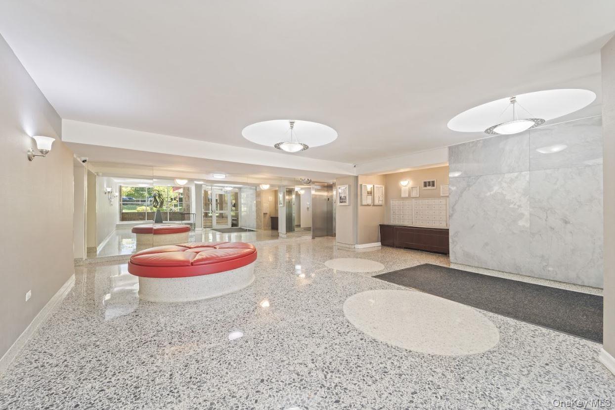 18-75 Corporal Kennedy Street, Unit 3J Queens, NY 11360 - Photo 4 of 27 a view of a bedroom with furniture and window