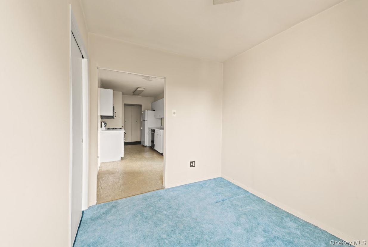 18-75 Corporal Kennedy Street, Unit 3J Queens, NY 11360 - Photo 8 of 27 a view of a room with a hallway