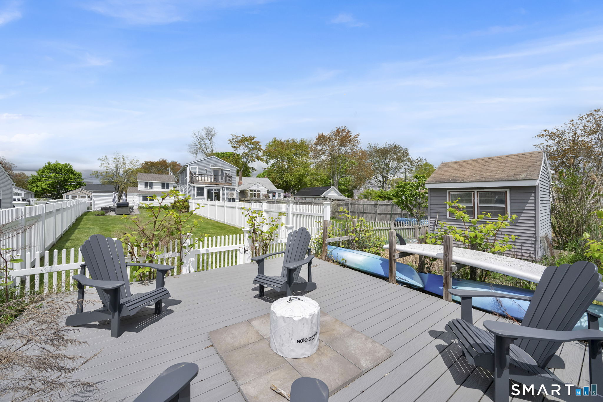 96 Chalker Beach Road Old Saybrook, CT 06475 - Photo 12 of 33 a view of a chairs and table in patio