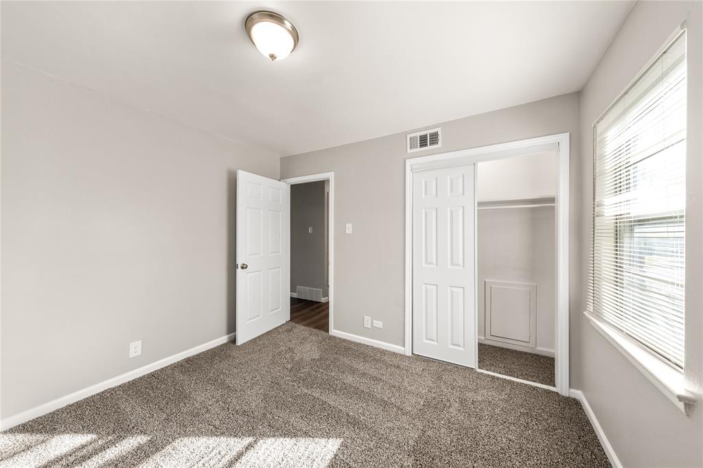 415 Walnut Street Duncanville, TX 75116 - Photo 13 of 22 a view of an empty room with a window