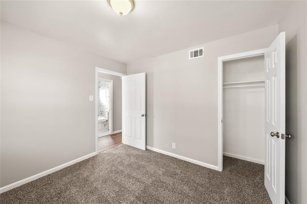 415 Walnut Street Duncanville, TX 75116 - Photo 17 of 22 a view of an empty room with closet area