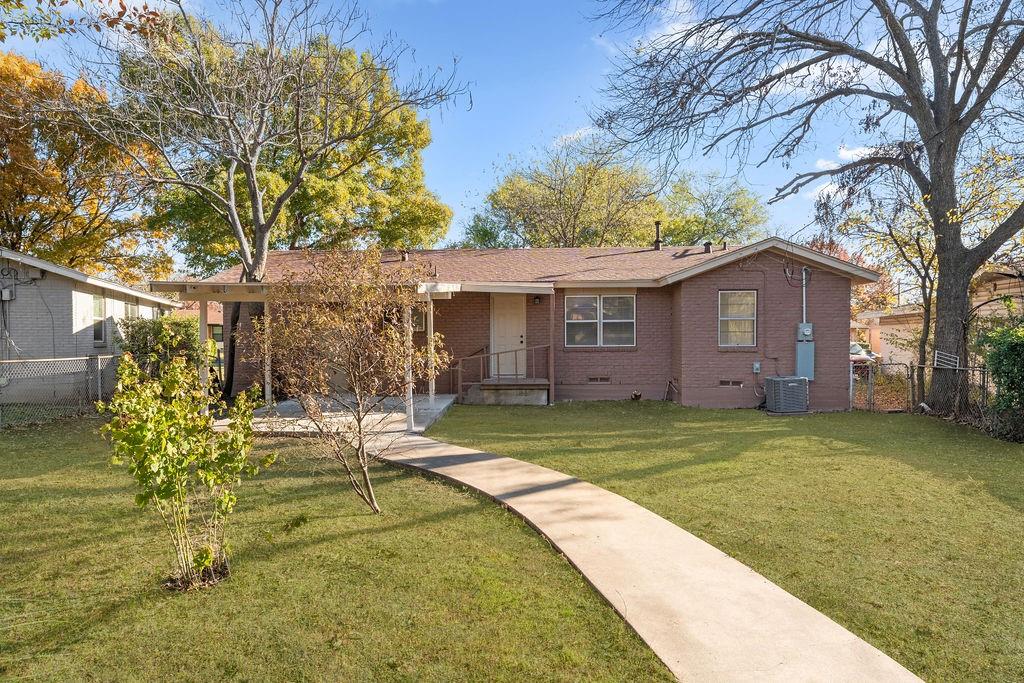 415 Walnut Street Duncanville, TX 75116 - Photo 19 of 22 a view of a house with a yard