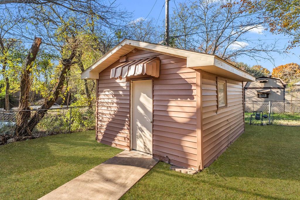 415 Walnut Street Duncanville, TX 75116 - Photo 20 of 22 a front view of a house with a yard