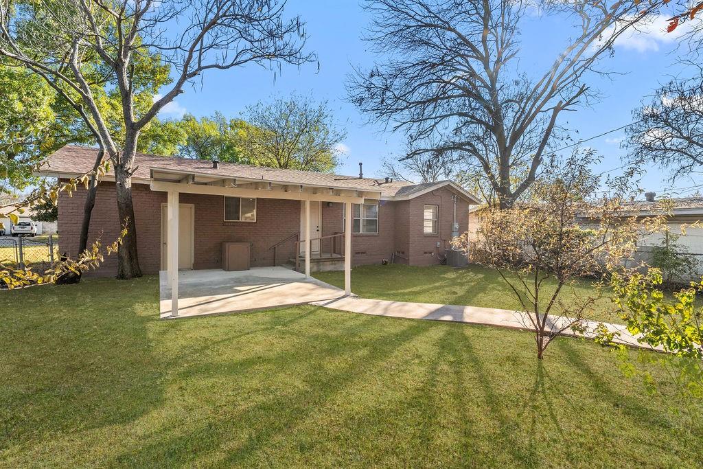 415 Walnut Street Duncanville, TX 75116 - Photo 22 of 22 a view of a house with backyard and tree