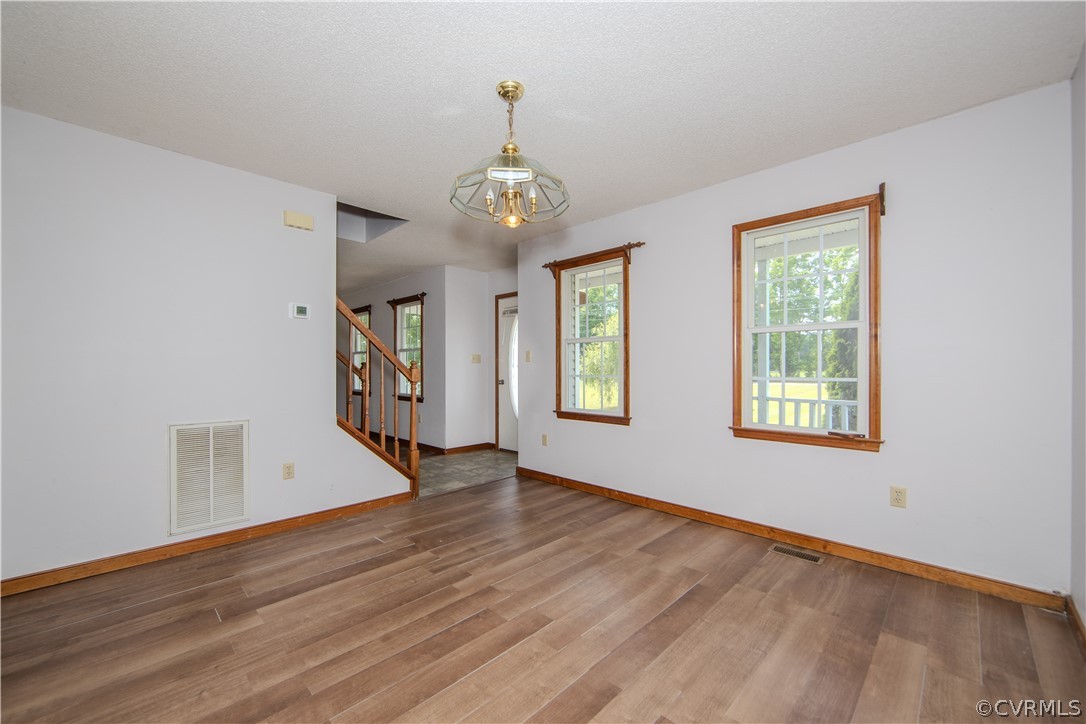 15895 Loving Union Road Disputanta, VA 23842 - Photo 11 of 42 a view of an empty room with wooden floor and a window