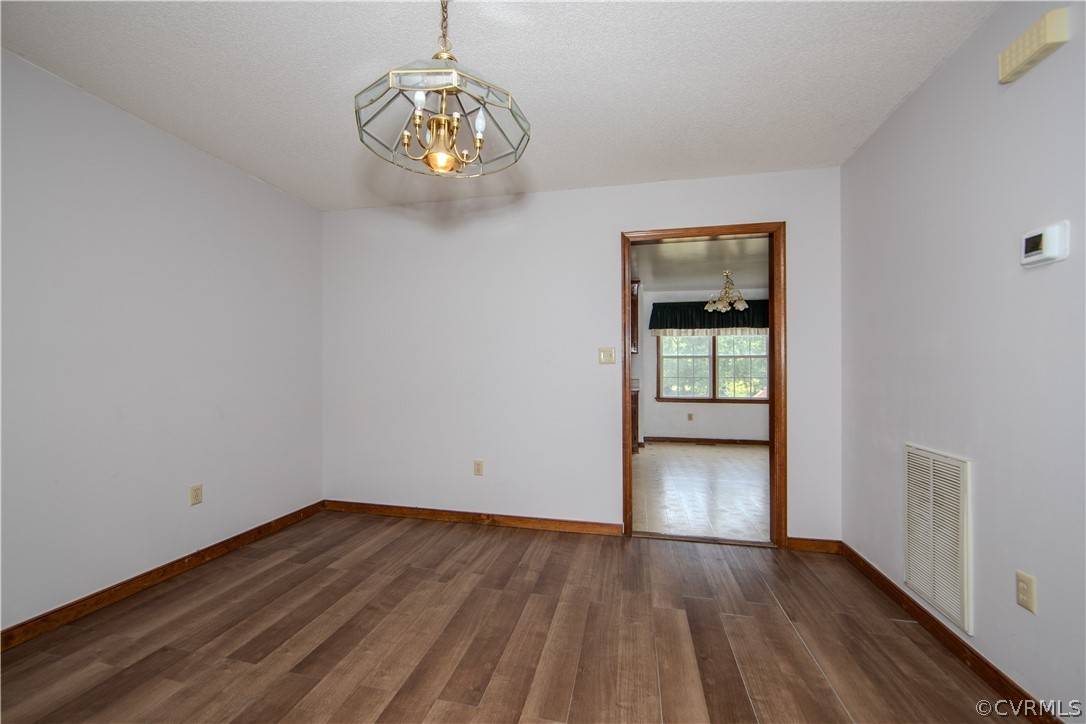 15895 Loving Union Road Disputanta, VA 23842 - Photo 12 of 42 wooden floor in an empty room with a window