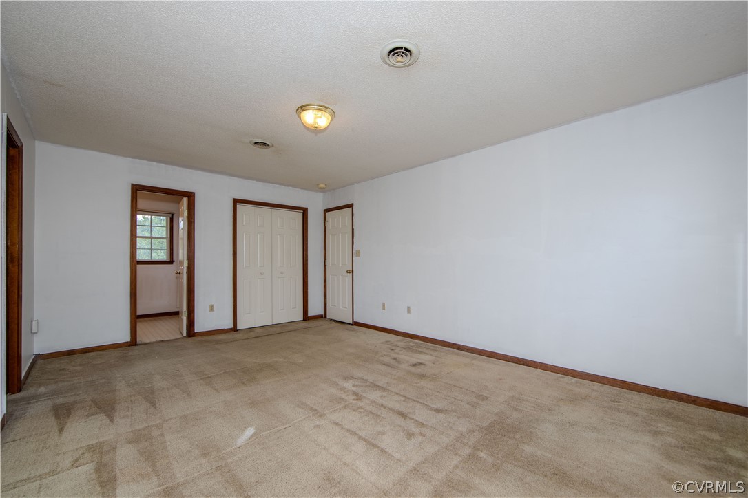 15895 Loving Union Road Disputanta, VA 23842 - Photo 19 of 42 a view of an empty room with a window