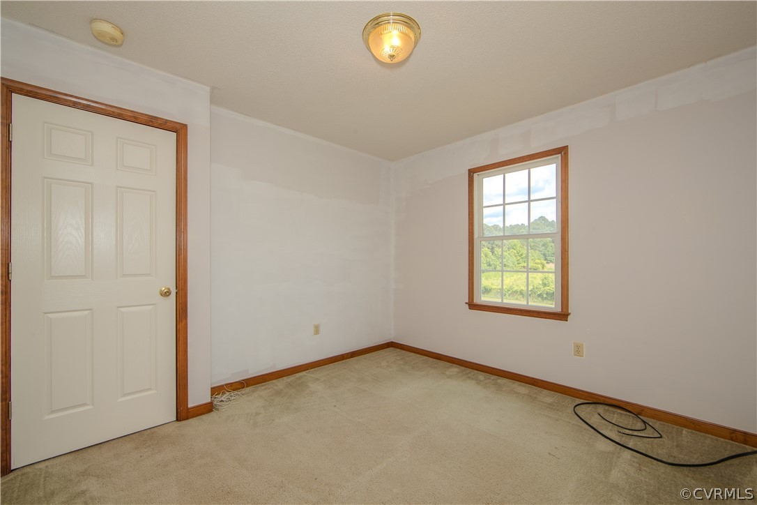 15895 Loving Union Road Disputanta, VA 23842 - Photo 26 of 42 an empty room with windows